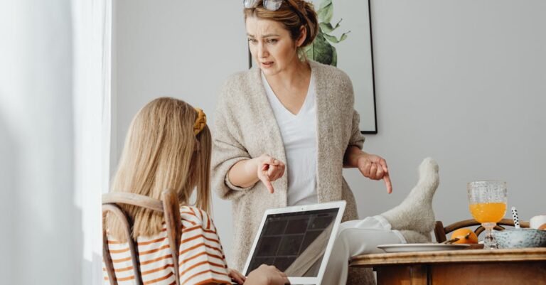 A mother scolds her daughter in a home setting, emphasizing family dynamics.